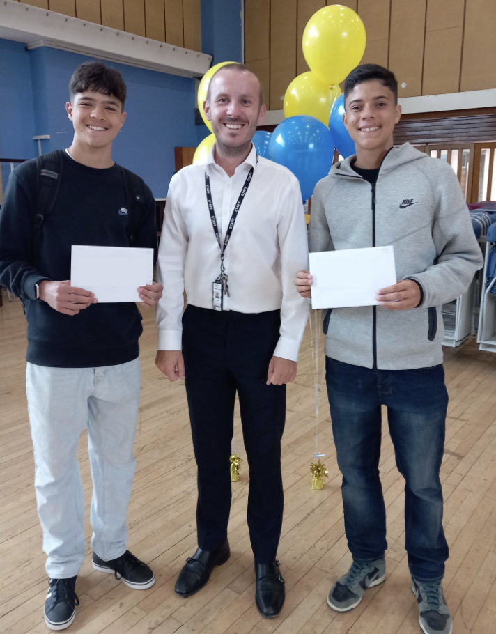 Students holding their results